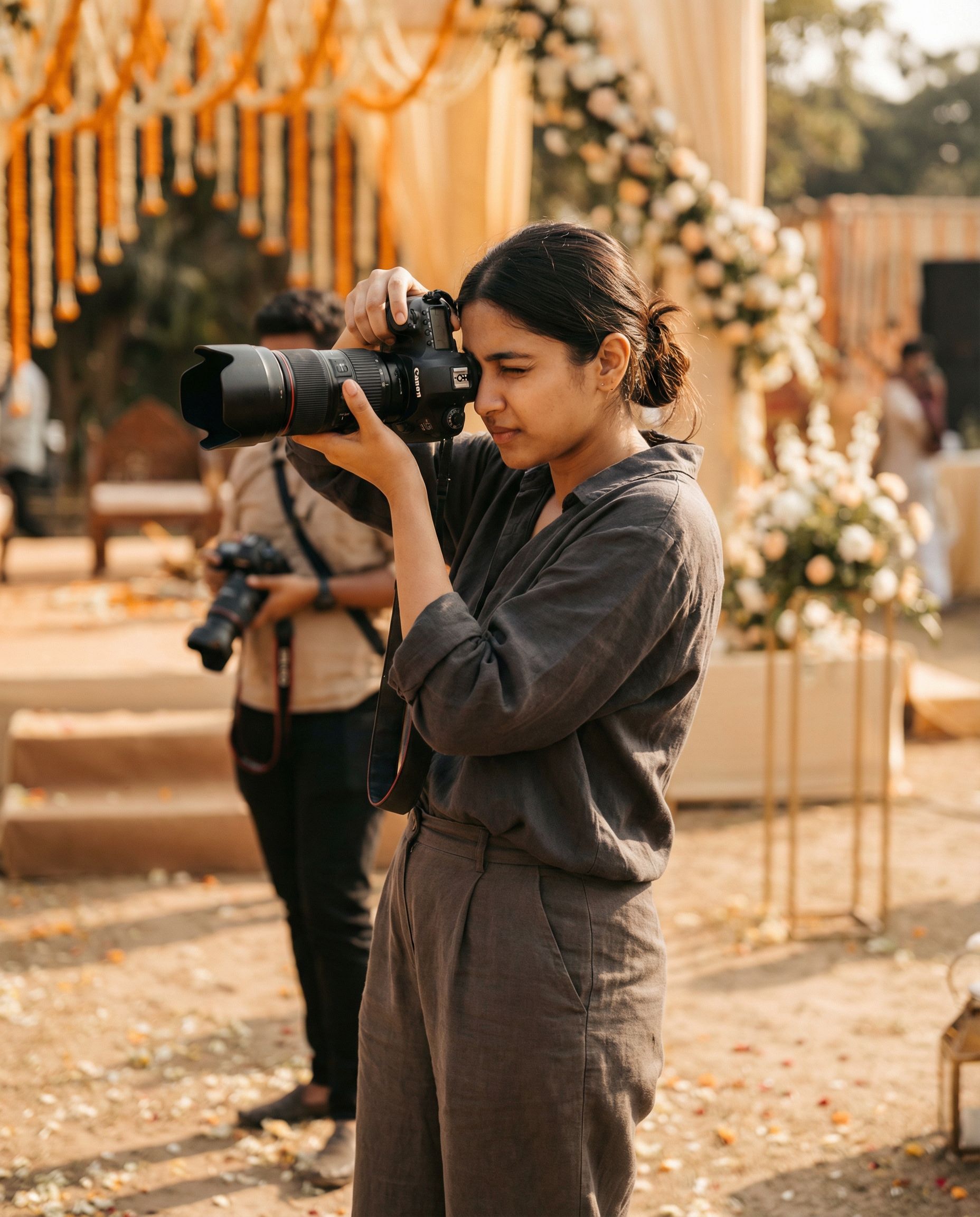 A professional wedding photographer at work, capturing an event.